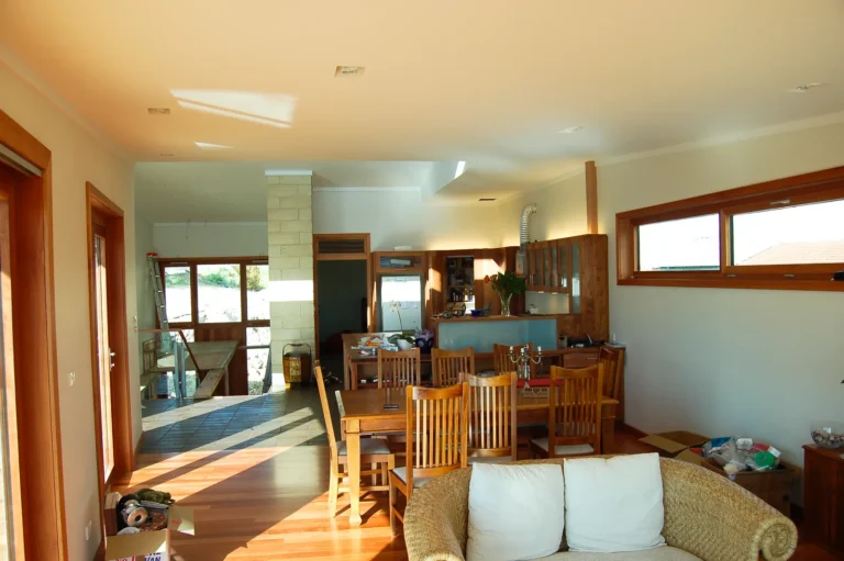 Dining area with timber floors under high clerestory windows